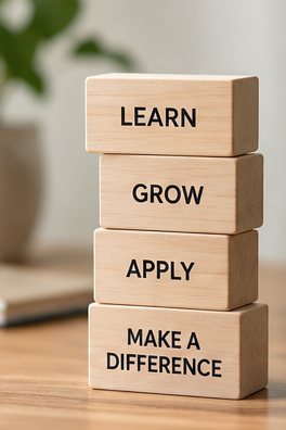 Wooden blocks reading learn, grow, apply, make a difference