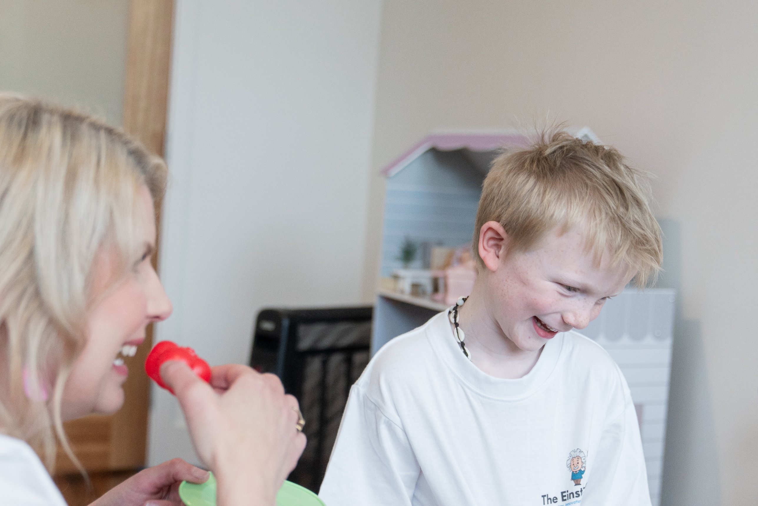 Meg Hughes during a play-based session with a young boy